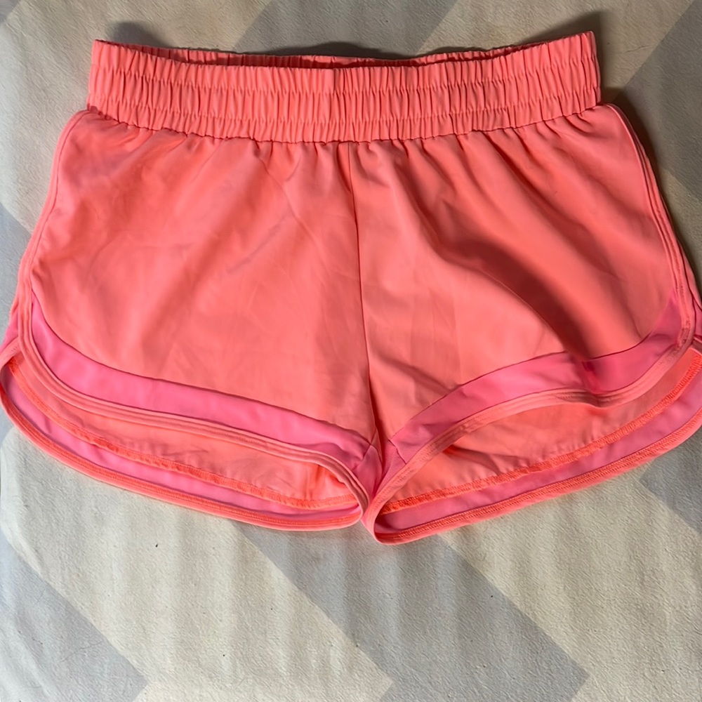 Buff Bunny running shorts in coral.